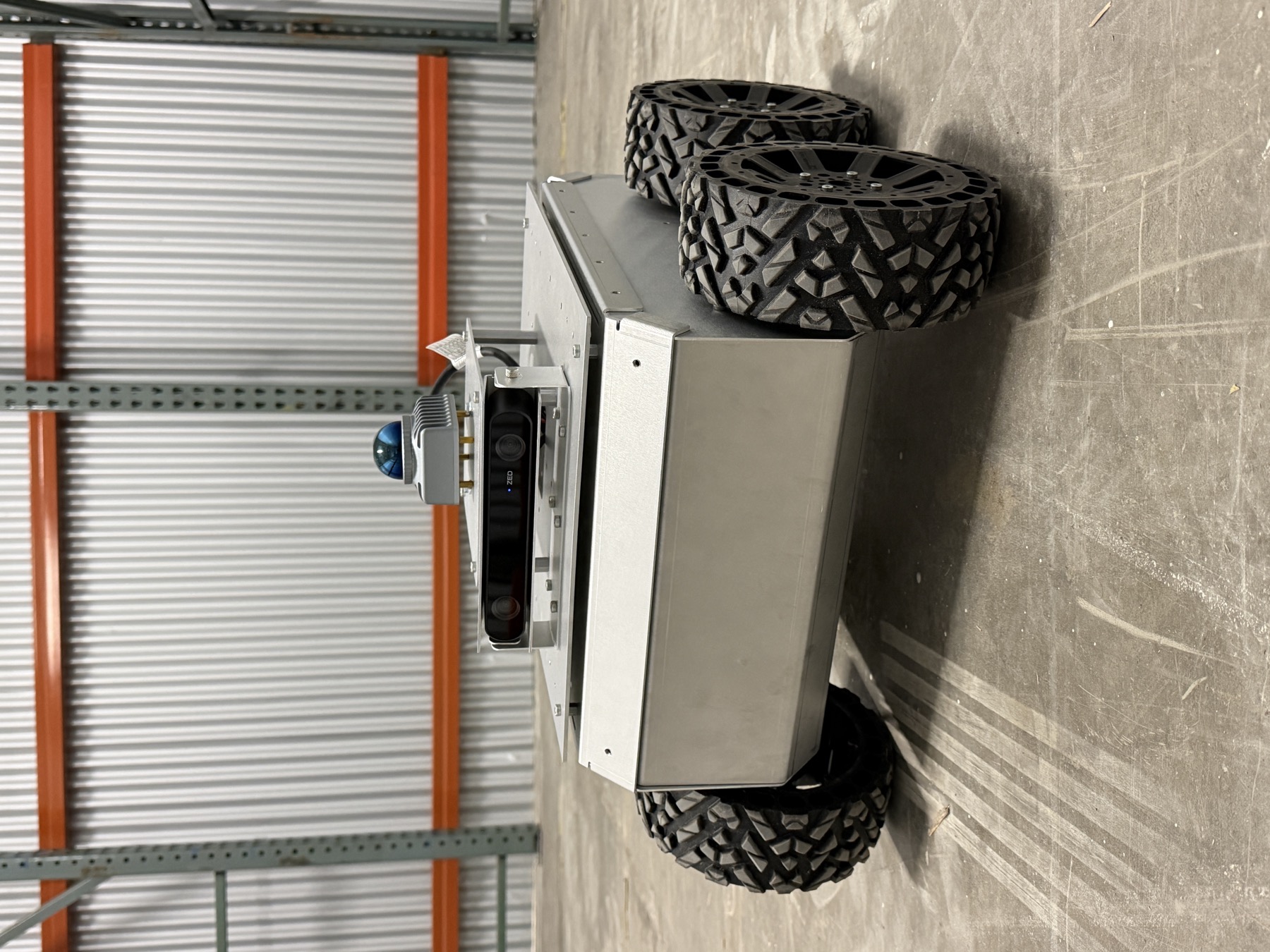 Echo's wheeled metal prototype with onboard sensors, photographed in our workshop